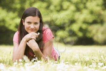 Royalty Free Photo of a Woman Lying on the Grass