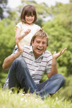 Royalty Free Photo of a Father and Daughter Outside