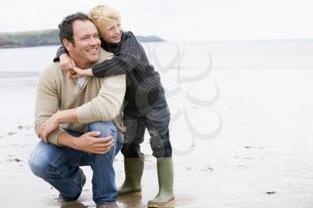 Royalty Free Photo of a Father and Son at the Beach
