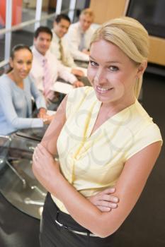 Royalty Free Photo of a Woman in Front of People in a Boardroom