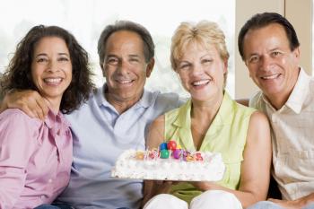 Royalty Free Photo of Couples With a Birthday Cake