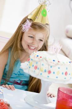 Royalty Free Photo of a Child With a Birthday Cake