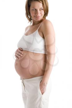 Royalty Free Photo of a Pregnant Woman With Her Stomach Exposed