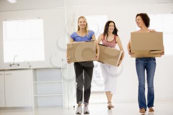 Royalty Free Photo of Three Girls Moving Into a New Home