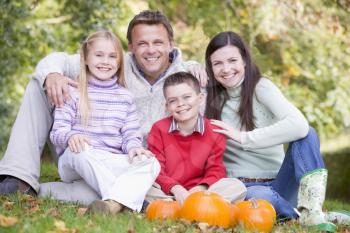Royalty Free Photo of a Family With Pumpkins