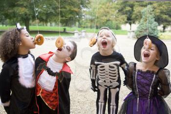 Royalty Free Photo of Children in Halloween Costumes Playing Games