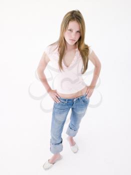 Royalty Free Photo of a Girl With Her Hands on Her Hips