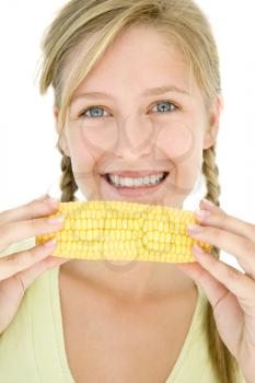 Royalty Free Photo of a Girl With Corn on the Cob