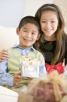 Royalty Free Photo of a Brother and Sister With Gifts