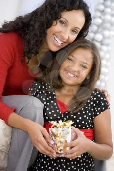 Royalty Free Photo of a Mother and Daughter With a Gift