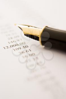 Royalty Free Photo of a Fountain Pen on a Paper With Numbers