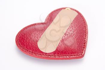 Royalty Free Photo of a Bandaid Covering a Heart