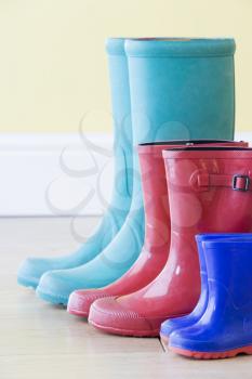 Royalty Free Photo of a Row of Rubber Boots