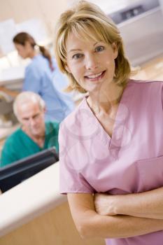 Royalty Free Photo of a Nurse at a Reception Area