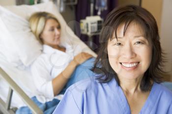 Royalty Free Photo of a Nurse With a Pregnant Woman