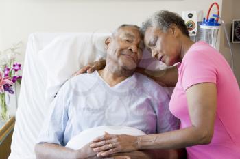 Royalty Free Photo of a Couple Embracing in the Hospital