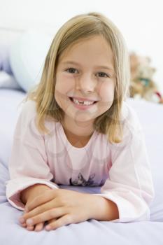 Royalty Free Photo of a Young Girl on the Bed