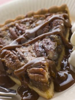 Royalty Free Photo of Pecan Pie With Caramel Sauce