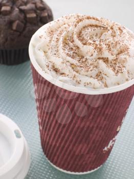 Royalty Free Photo of a Cup Of Hot Chocolate With A Double Chocolate Muffin