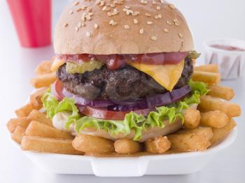 Royalty Free Photo of a Cheeseburger and Fries