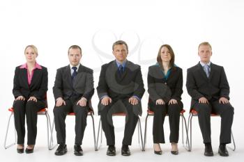 Group Of Business People Sitting In A Line 
