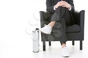 Royalty Free Photo of a Businessman in White Sneakers