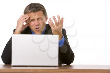Royalty Free Photo of an Angry Man at a Laptop