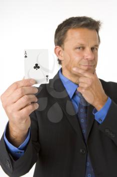 Royalty Free Photo of a Businessman With an Ace of Clubs