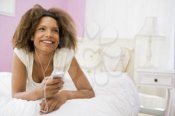 Royalty Free Photo of a Teenage Girl Listening to an MP3 Player