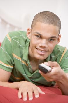 Royalty Free Photo of a Boy Using a Remote Control