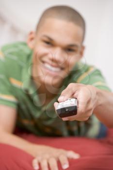 Royalty Free Photo of a Boy Using a Remote Control
