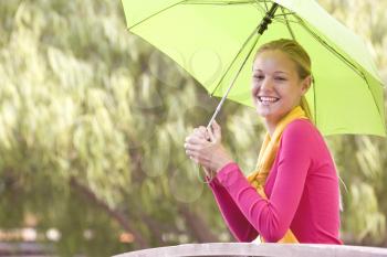 Royalty Free Photo of a Girl With an Umbrella