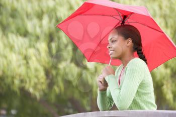 Royalty Free Photo of a Girl With an Umbrella