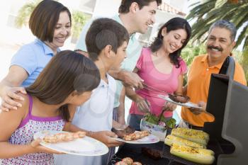 Royalty Free Photo of a Family Enjoying a Barbecue