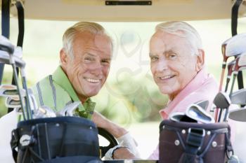 Royalty Free Photo of Two Men in a Golf Cart