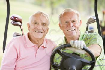 Royalty Free Photo of Two Guys in a Golf Cart