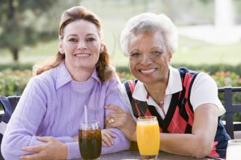 Royalty Free Photo of Two Women Having a Drink