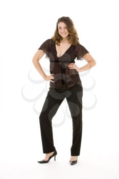 Royalty Free Photo of a Smiling Woman With Her Hands on Her Hips