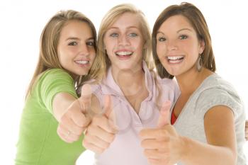Royalty Free Photo of Teenage Girls Giving a Thumbs Up