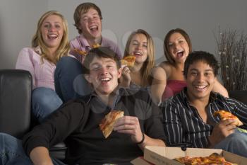 Royalty Free Photo of Teens Eating Pizza