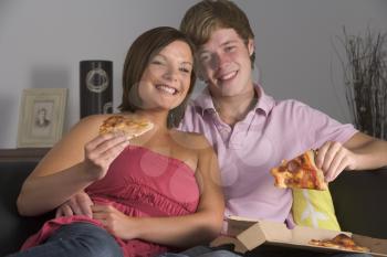 Royalty Free Photo of Couple Eating Pizza