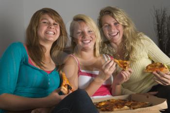 Royalty Free Photo of Teens Having Pizza