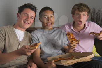 Royalty Free Photo of Teenagers Having Pizza