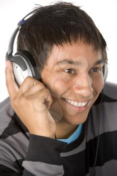 Royalty Free Photo of a Boy Listening to Headphones