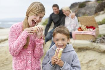 Royalty Free Photo of a Family Having a Picnic at the Beach