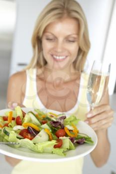 Royalty Free Photo of a Woman With Wine and Salad