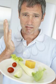 Royalty Free Photo of a Man With a Plate of Healthy Food