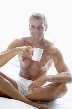 Royalty Free Photo of a Man Having a Cup of Coffee