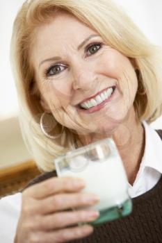Royalty Free Photo of a Woman With a Glass of Milk