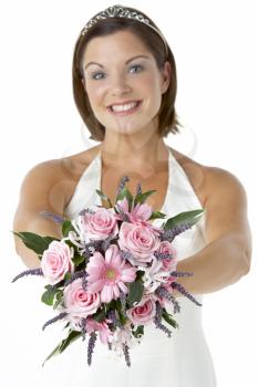 Royalty Free Photo of a Bride Holding Flowers